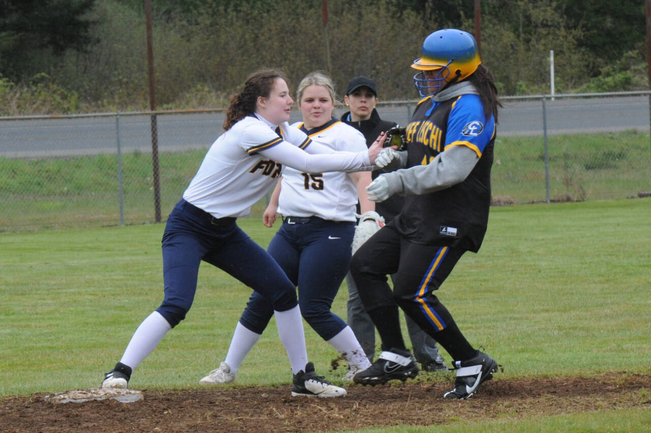 Lonnie Archibald/for Peninsula Daily News
Forks centerfielder Keira Johnson hustles to cover second base tagging out a Chief Leschi. Looking on is second baseman Nicole Winger. The Spartans won a doubleheader by the scores of 28-0 and 17-0.