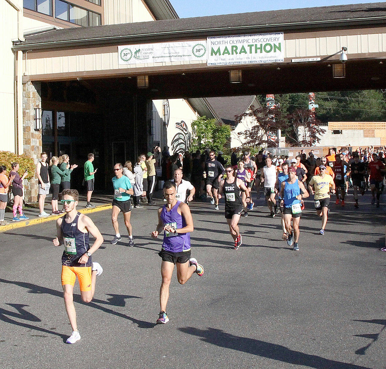 Runners take off at the start of the North Olympic Discovery Marathon in June 2019, the last time the public was allowed to attend the marathon. (Dave Logan/for Peninsula Daily News)