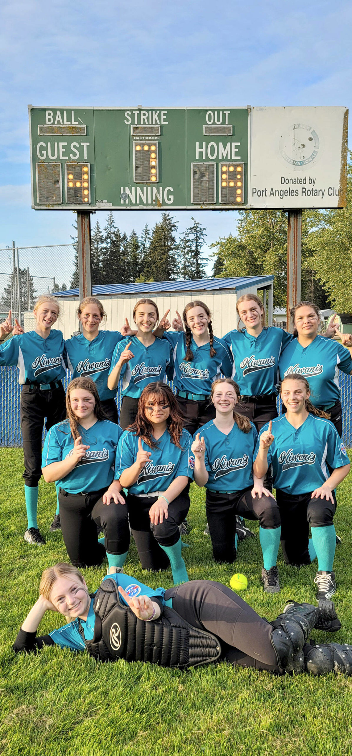 Kiwanis claimed the North Olympic Baseball and Softball 16U softball title Wednesday night with a 9-4 win over KONP. Team members are, back row from left, Kiana Grippo, Becca Manson, Maryrose Halberg, Hannah Hairell, Mya Hartman, Angelica Sullivan, front row Abby Rudd, Natalie Thompson, Lily Thomas, Kennedy Rognlien and catcher Alexis Perry lying down. Kiwanis is coached by Christine Halberg, Casey Rudd and Hannah Hairell.