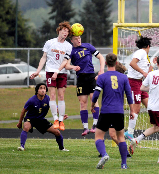 Sequim’s Aidan Henninger, right, vies for a header with a Kingston defender during a game in April. (Michael Dashiell/Olympic Peninsula News Group)