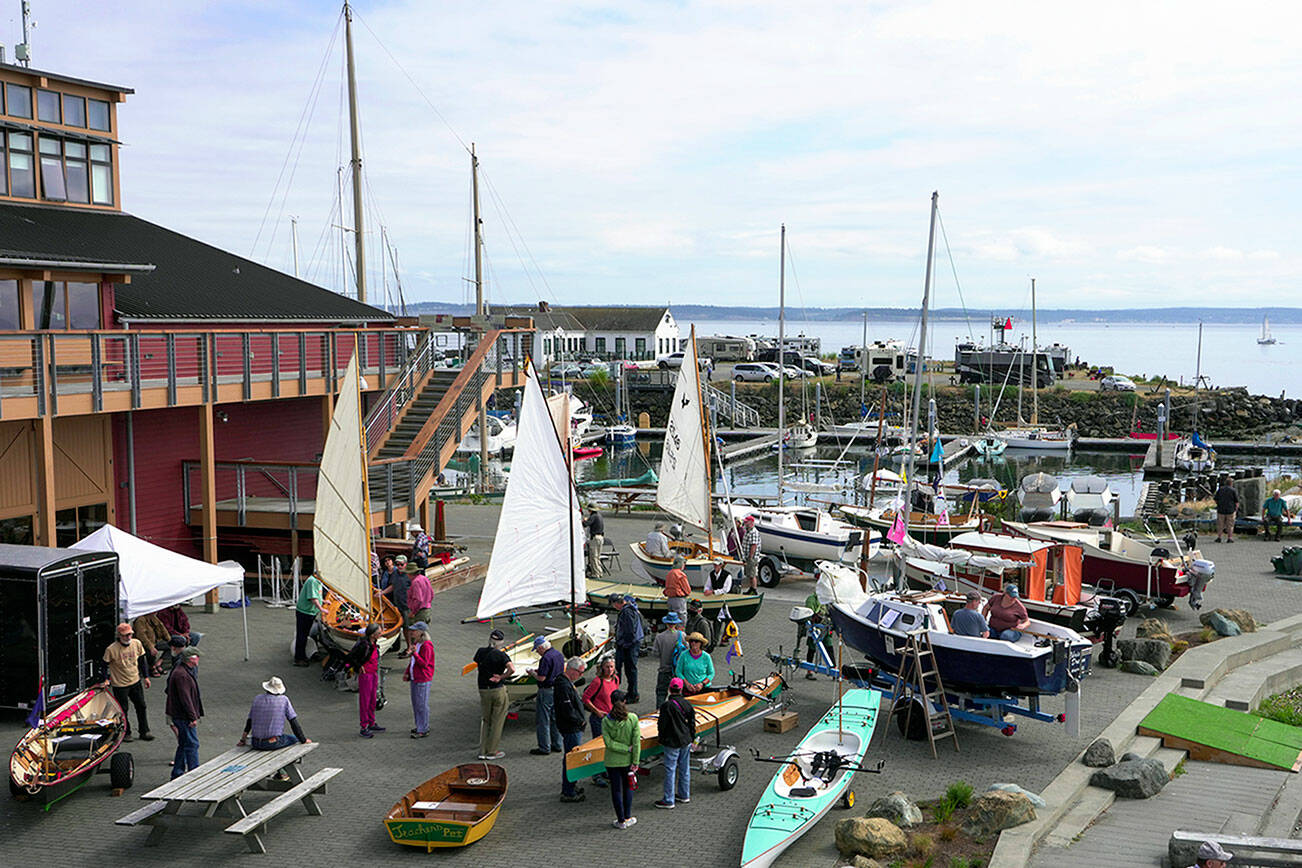 Several of the 50 registered pocket yachts were on display during the Port Townsend Pocket Yacht Palooza at the Northwest Maritime Center First Fed Waterfront Commons on Saturday. Billed as the largest exhibit of small craft in North America, the one-day show attracts small, trailerable boats from around Puget Sound. Any boat of 20 feet or less could be considered a pocket yacht. (Steve Mullensky/for Peninsula Daily News)