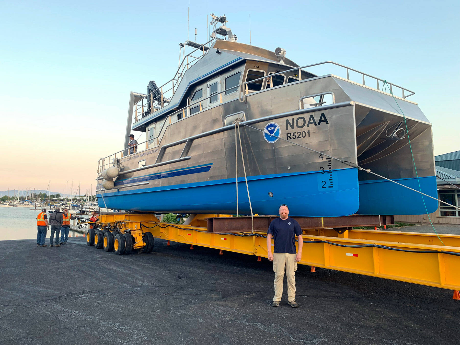 Sanctuary Superintendent Kevin Grant is in the foreground at a 2021 boat launching in Bellingham. (NOAA)