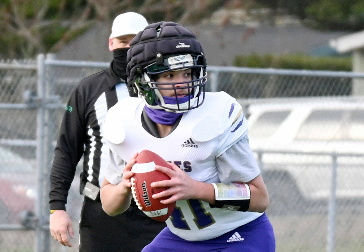 FOOTBALL: NFL following Sequim's lead with protective caps