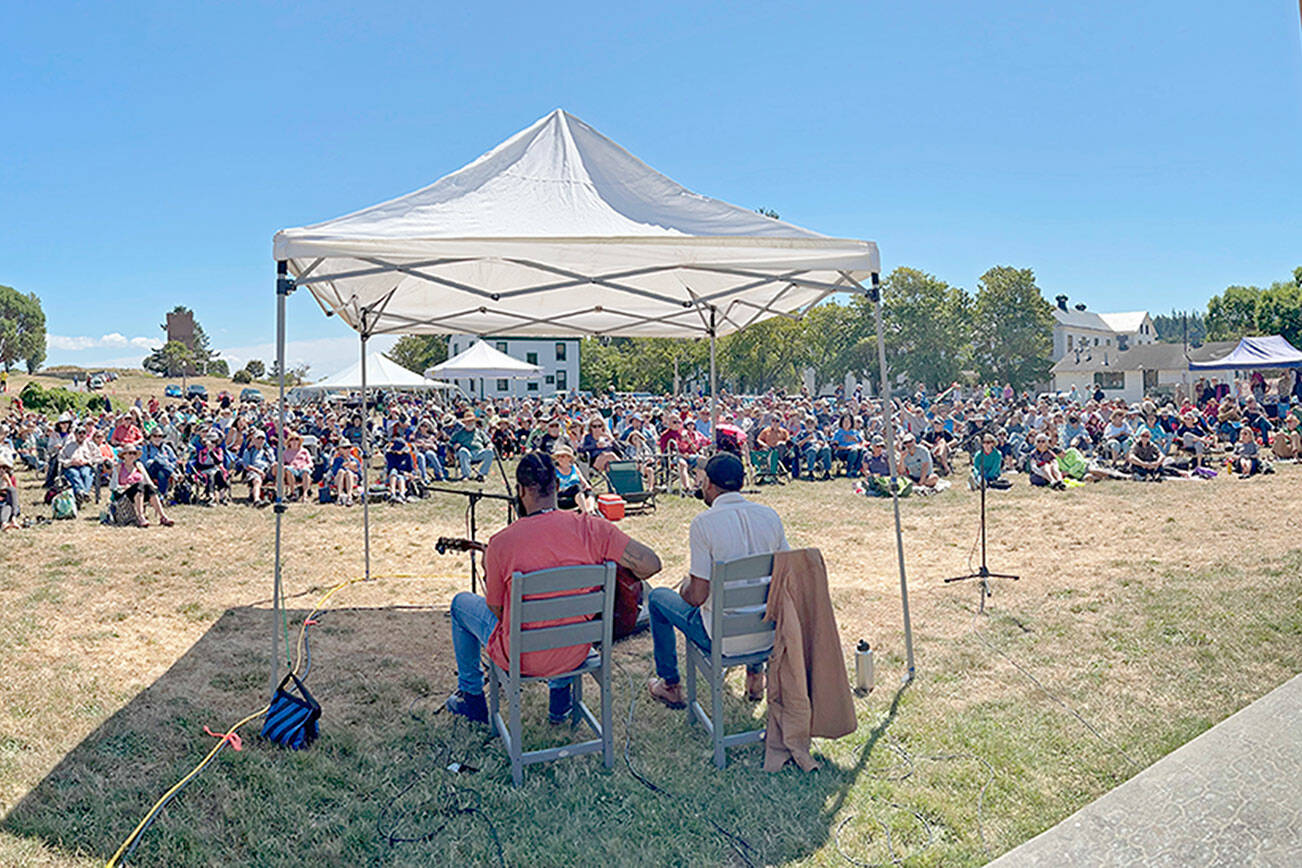 Steve Mullensky/for Peninsula Daily News
The largest audience of the summer showed up for the final Free Fridays at the Fort blues concert by performed by musicians Jayy Hopp, left, and Andrew Alli on the Commons at Fort Worden State Park on Friday. That night, the The Port Townsend Acoustic Blues Festival also hosted Blues in the Clubs. Today, the Centrum program will present the Acoustic Blues Showcase Concert on Littlefield Green outside the McCurdy Pavilion at 1:30 p.m. and host another Blues in the Clubs tonight. For information, and tickets, see https://centrum.org/programs/blues/.