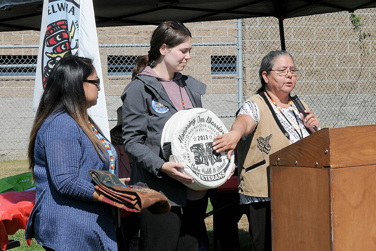 KEITH THORPE/PENINSULA DAILY NEWS
Frances Charles, chairwoman of the Lower Elwha Klallanm Tribe, right, talks about items representaing native heritage as tribal members Dawn Stephan, holding a Pendleton blanket, left, and Tessa Velasco, holding a drum, listen in during a kick-off celebration for a newly-established Indian Child Welfare Court on Wednesday at the Clallam County Juvenile Services Center in Port Angeles. The court, developed through the federal Indian Child Welfare Act, will serve and assist Native American families whose children have been found to be dependent on the state.