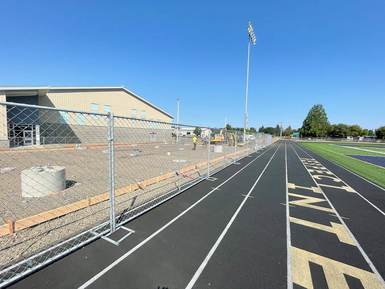 The $3.35 million Spartan Stadium grandstand replacement project is projected to be completed by Oct. 28, when the Forks High School football team plays its final home game of the season. The Quillayute Valley School District is using timber dollars from the Junior Taxing District, not a bond measure, to fund Phase I of the project that includes the new grandstand and ticket booth. (Paula Hunt/Peninsula Daily News)