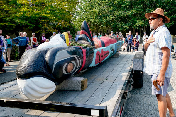 Freddie Lane, with the Lummi Indian Tribe, talks about a totem pole, carved by Uncle Doug James of the House of Tears carvers during a blessing on Sunday at the Quimper Unitarian Universalist Fellowship in Port Townsend. The pole will leave Wednesday for a cross-country trip to Pittsburgh. (Steve Mullensky/for Peninsula Daily News)