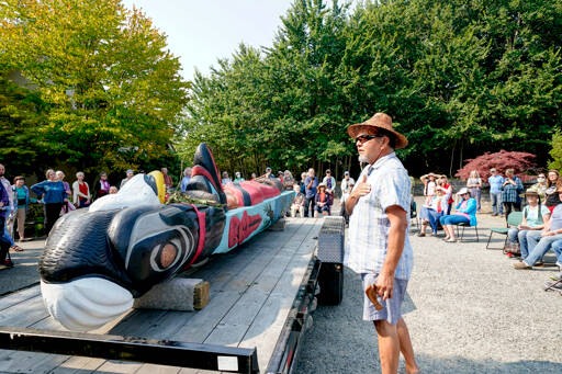 Freddie Lane, with the Lummi Indian Tribe, talks about a totem pole, carved by Uncle Doug James of the House of Tears carvers during a blessing on Sunday at the Quimper Unitarian Universalist Fellowship in Port Townsend. The pole will leave Wednesday for a cross-country trip to Pittsburgh. (Steve Mullensky/for Peninsula Daily News)