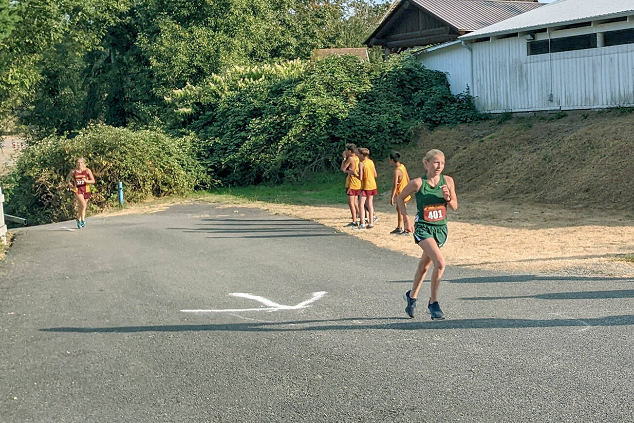 Rodger Johnson/Port Angeles Cross Country
Port Angeles freshman Leia Larson runs up the final hill in a cross country meet at the Kitsap County Fairgrounds. Larson finished fourth in her first-ever varsity meet.