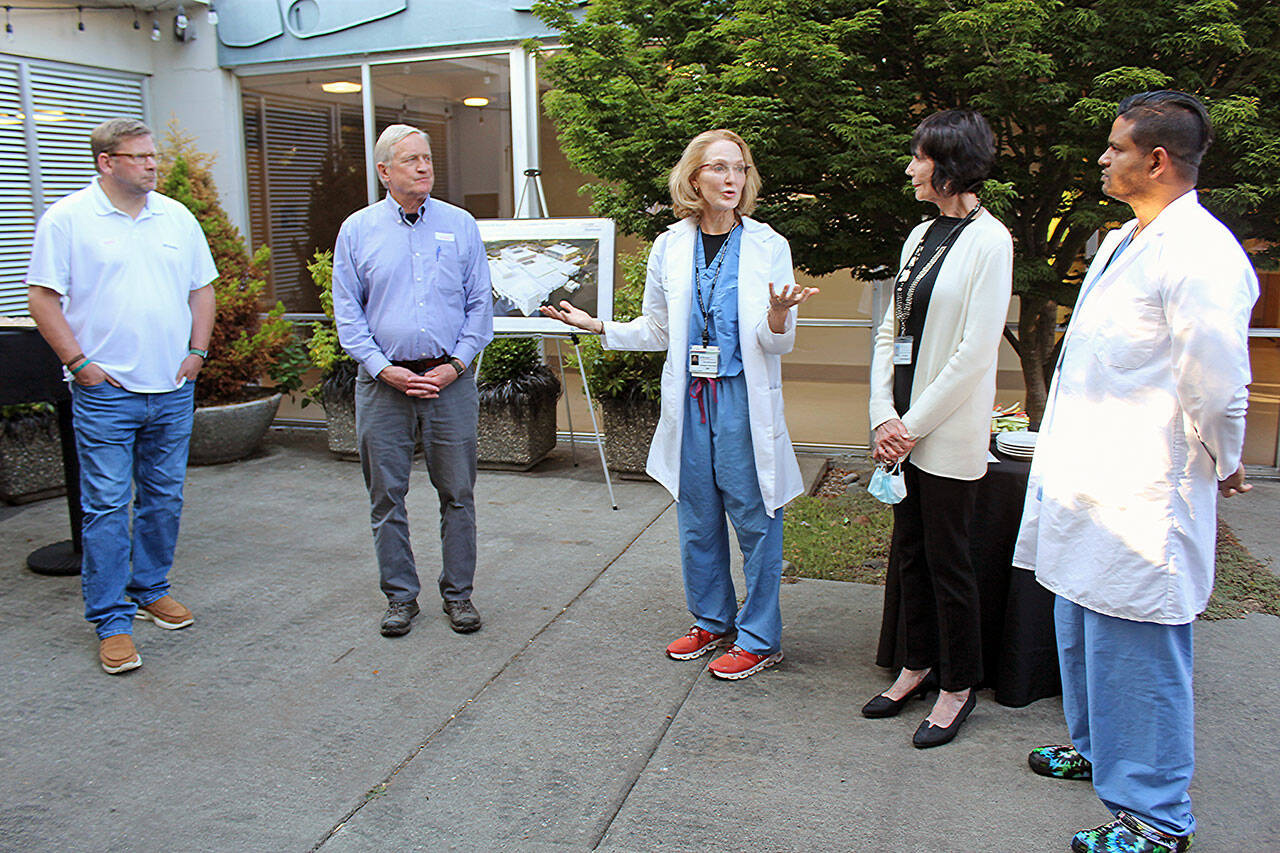 Jefferson Healthcare’s Campus Expansion and Modernization project is explained to state Reps. Mike Chapman and Steve Tharinger, far left, earlier this week. Dr. Christine Skorberg, middle, speaks to them about the importance of an expanded obstetrics and gynecology clinic while hospital Commissioner Jill Buhler Rienstra and Dr. Asif Luqman, far right, look on. (Jefferson Healthcare)