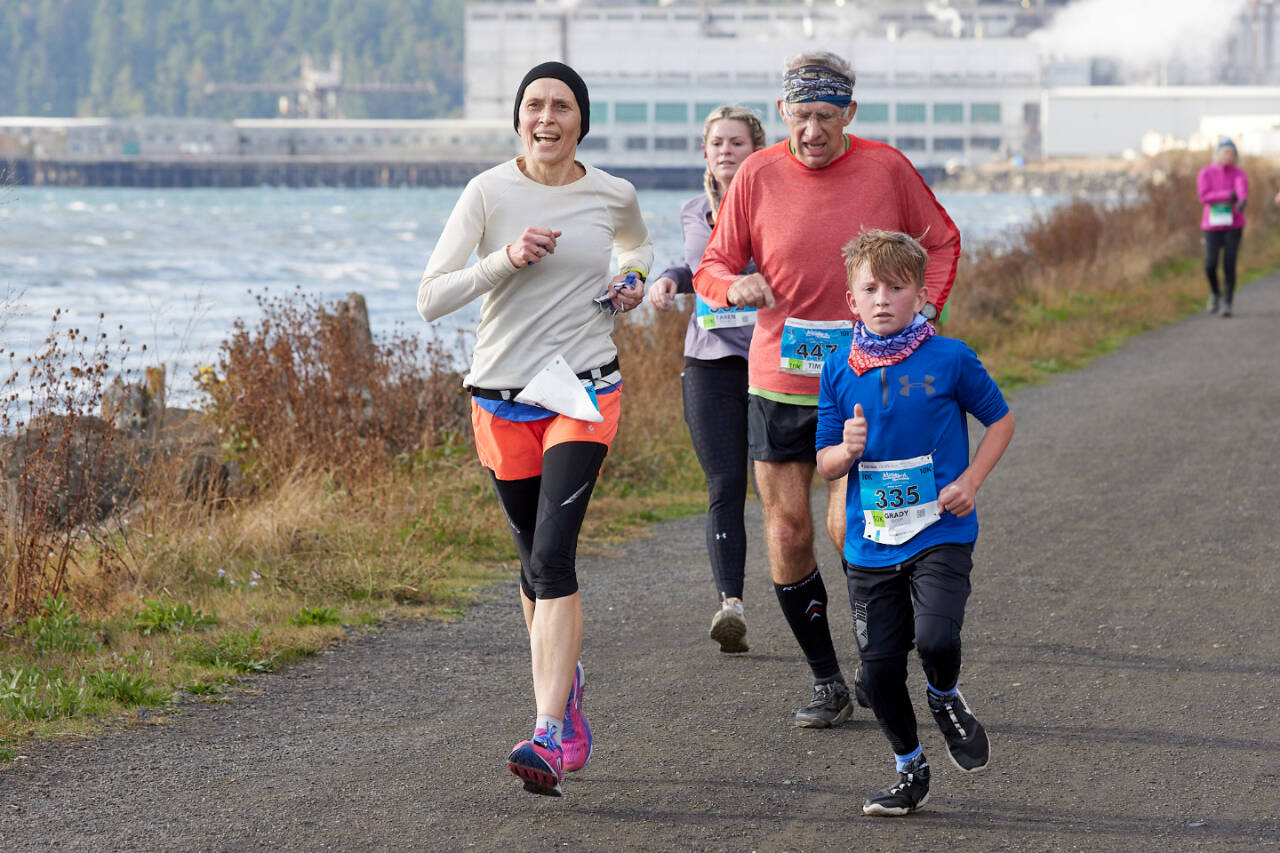 Grady Moon (335), Tim Branham (447), Taren Reaves (362) and another runner compete in the Larry Scott Trail Run in 2021 in Port Townsend. (Courtesy of Port Angeles Marathon Association)