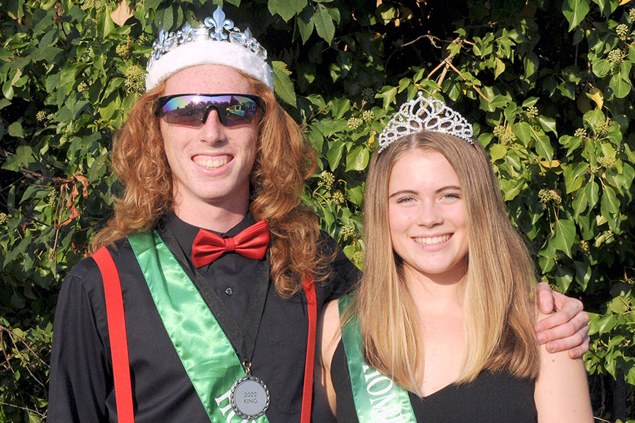 Port Angeles High School senior homecoming King and Queen Jack Gladfelter and Lily Halberg prepare to ride in their school’s homecoming parade after being crowned on Friday. The pair presided over the Port Angeles Roughriders’ 28-9 loss to the Bremerton Knights during Friday’s football game at Port Angeles Civic Field. (Keith Thorpe/Peninsula Daily News)