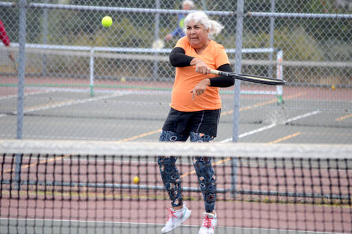 Martha Olbrych of Port Ludlow is part of the tennis crew at the Port Townsend High School courts on Wednesdays and Sundays. Players of various levels are getting together for morning doubles as long as the weather stays tennis-friendly. Anyone interested in joining the group can contact organizer David Michael at harp@olympus.net. (Diane Urbani de la Paz/for Peninsula Daily News)