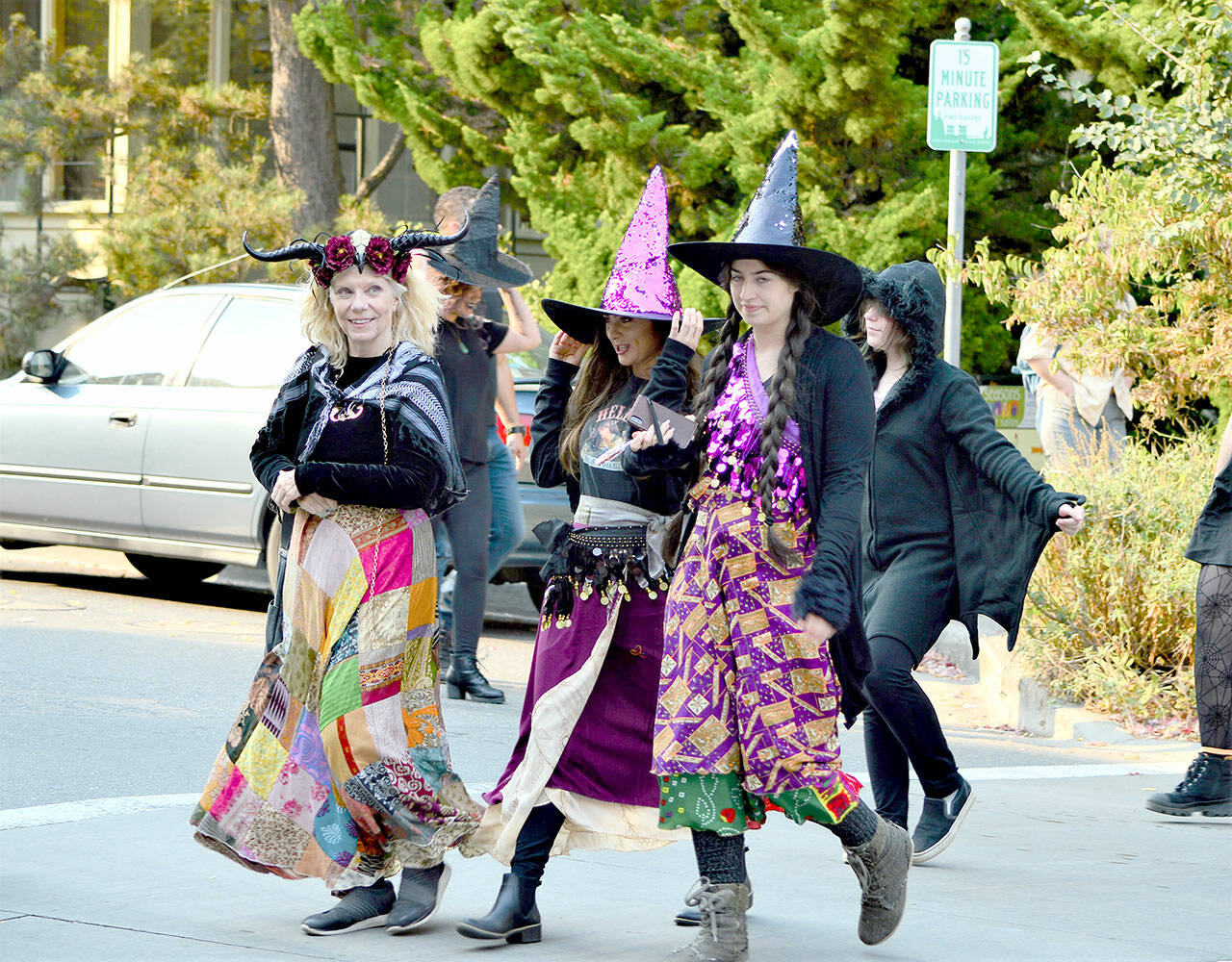 From left, Nancy Mandell, Julia Escobedo and Mandy Escobedo partake in the inaugural Witches’ Walk through downtown Port Townsend on Saturday. Some 50 witches — women, children and men among them — assembled at Haller Fountain and sashayed through traffic to Pope Marine Park. (Diane Urbani de la Paz/For Peninsula Daily News)