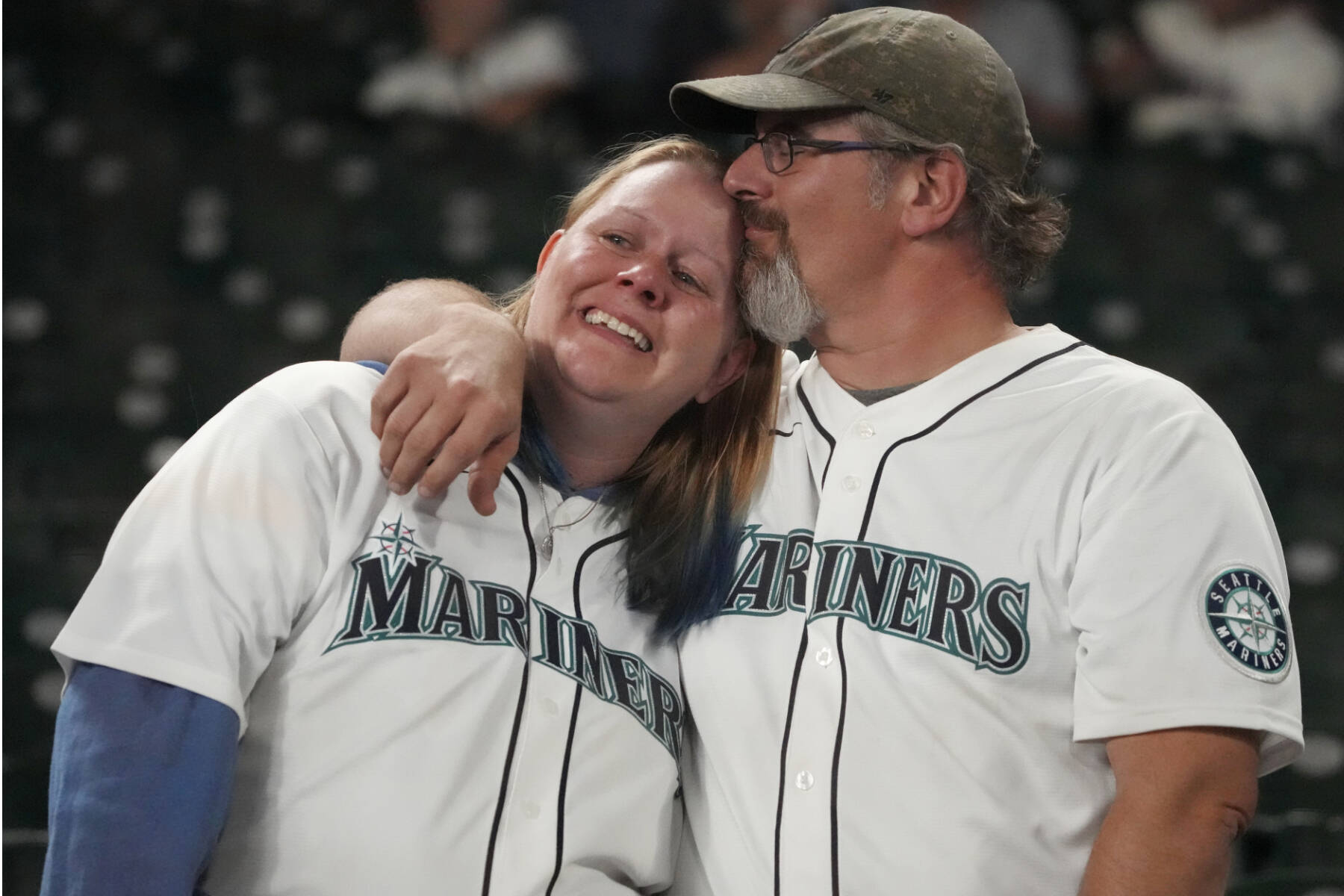 Seattle Mariners fans react after the Seattle Mariners lost to the Houston Astros in Game 3 of an American League Division Series baseball game Saturday, Oct. 15, 2022, in Seattle. (Ted S. Warren/The Associated Press)