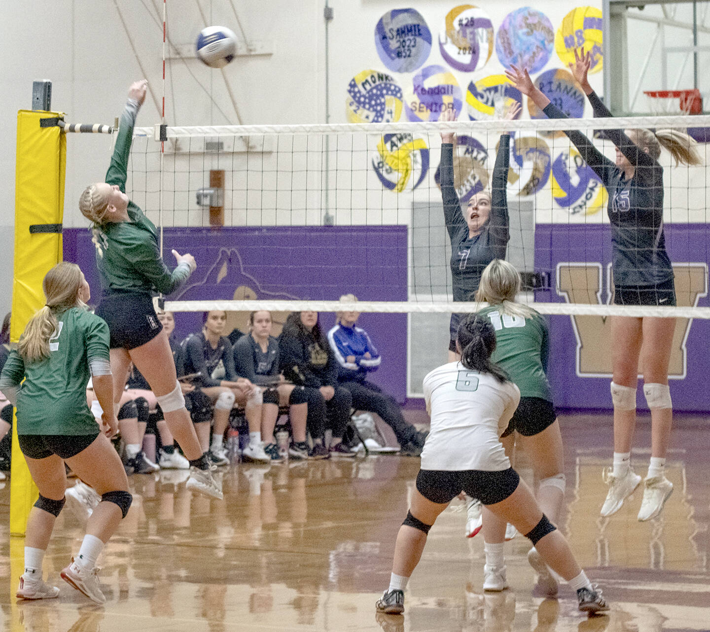 Emily Matthiessen/Olympic Peninsula News Group

#1 Port Angeles' Alaina Baublitz, left, looks to hit past the block of Sequim's Sydney Clark, center, and Kendall Hastings in an Olympic League tournament game on Nov. 3 in Sequim. The host Wolves topped PA's Roughriders in three games.