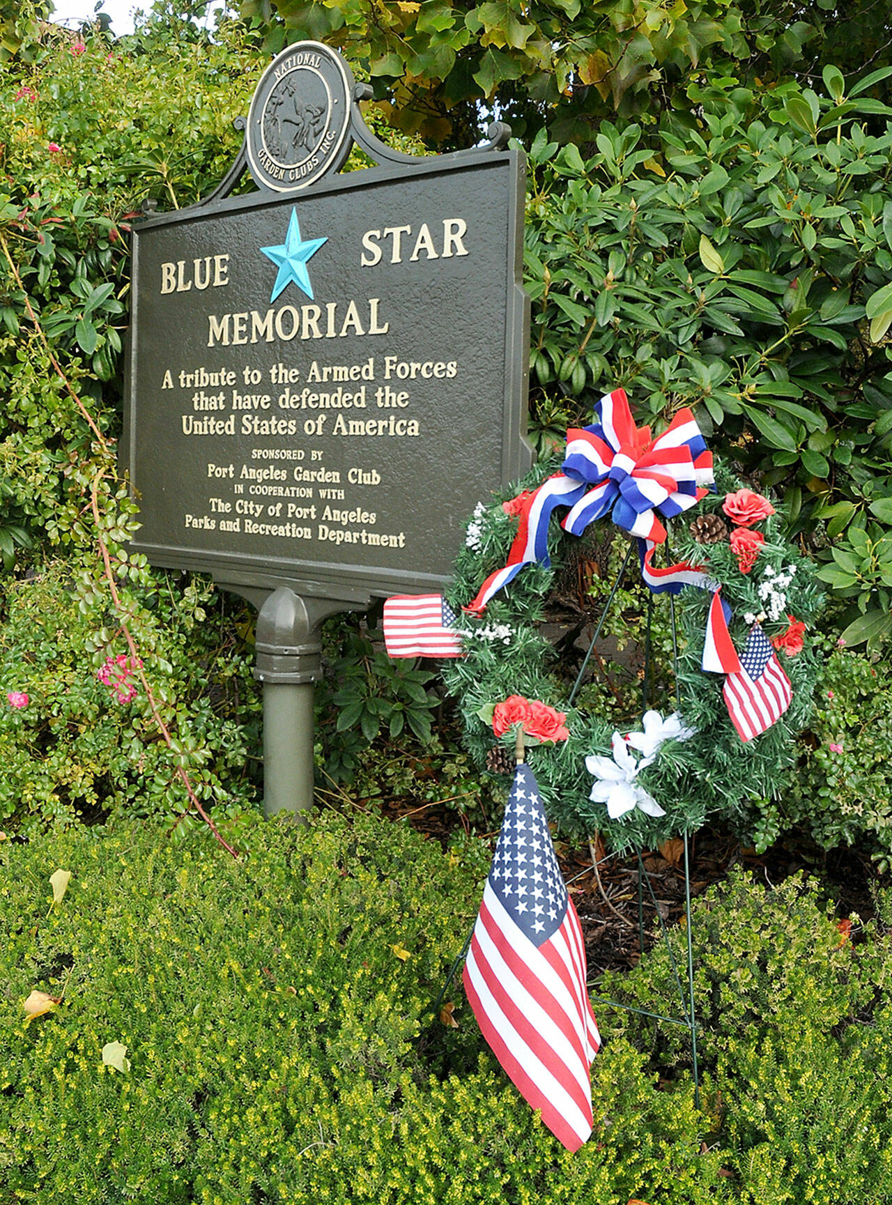 A wreath stands next to the Blue Star Memorial armed forces tribute marker on Thursday at Veteran’s Park in Port Angeles. (KEITH THORPE/PENINSULA DAILY NEWS)