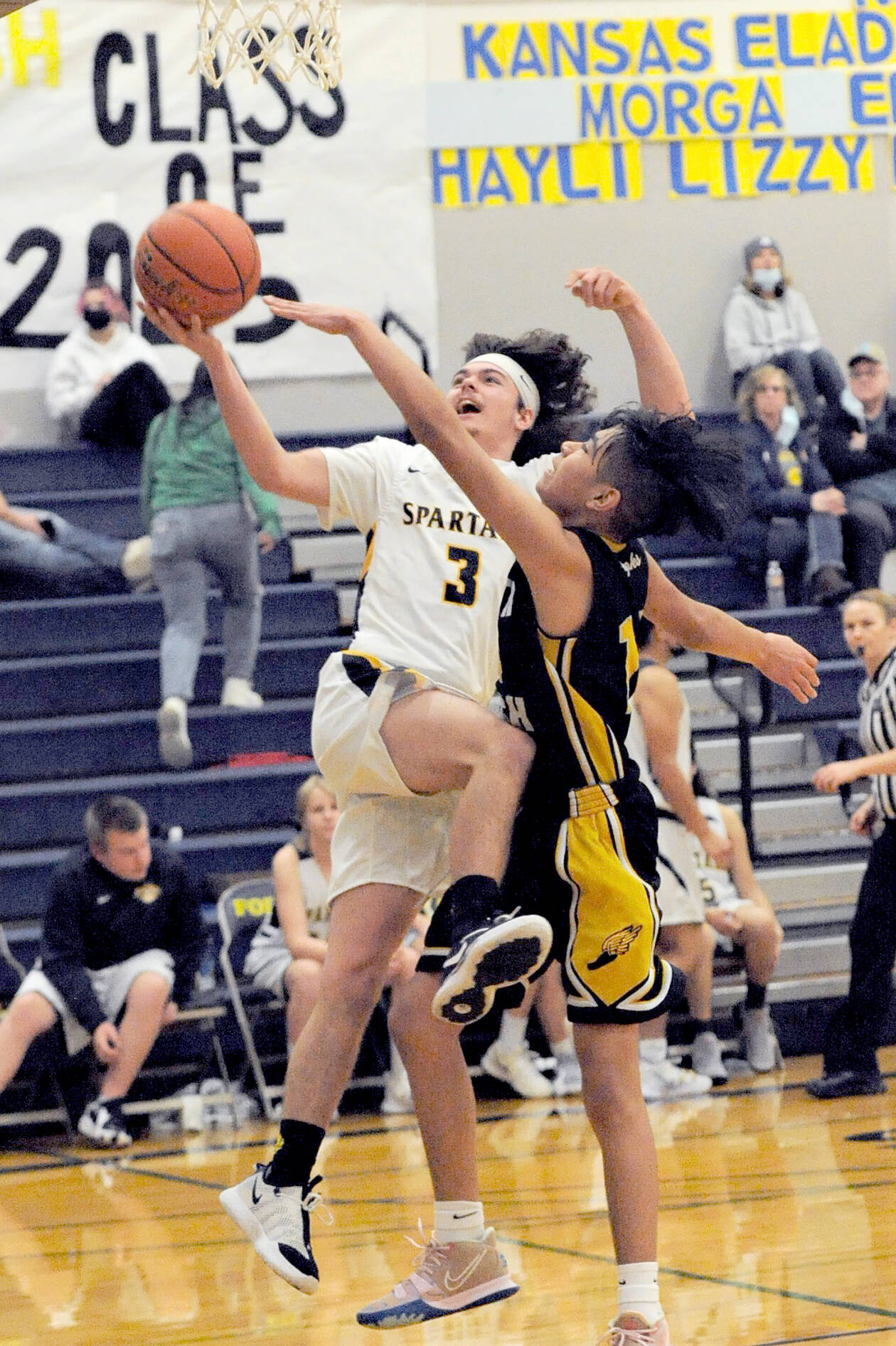 Lonnie Archibald/for Peninsula Daily News
Forks' Landin Davis attempts a layup during a game against North Beach last season. Davis is set to start for the Spartans this season.