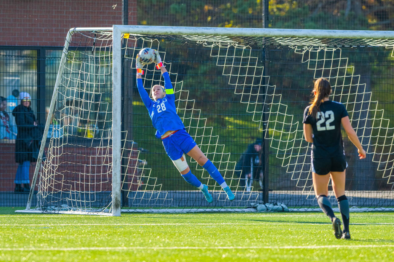 Photo courtesy of WWU Athletics / Claire Henninger makes a save in the NCAA Division II national quarterfinal game. A former Sequim soccer standout, Henninger is graduate student at Western Washington University and helped the WWU women's soccer team earn its second national title with a 2-1 win over West Chester (Pa.) on Dec. 3.