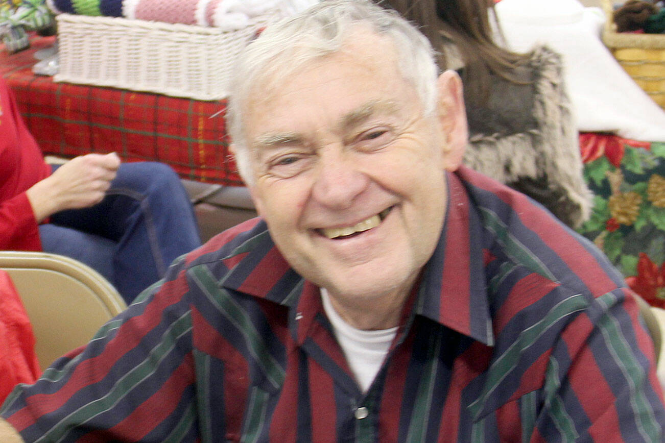 Lonnie Archibald, pictured at a book signing, is the author of a new book about Clallam County.