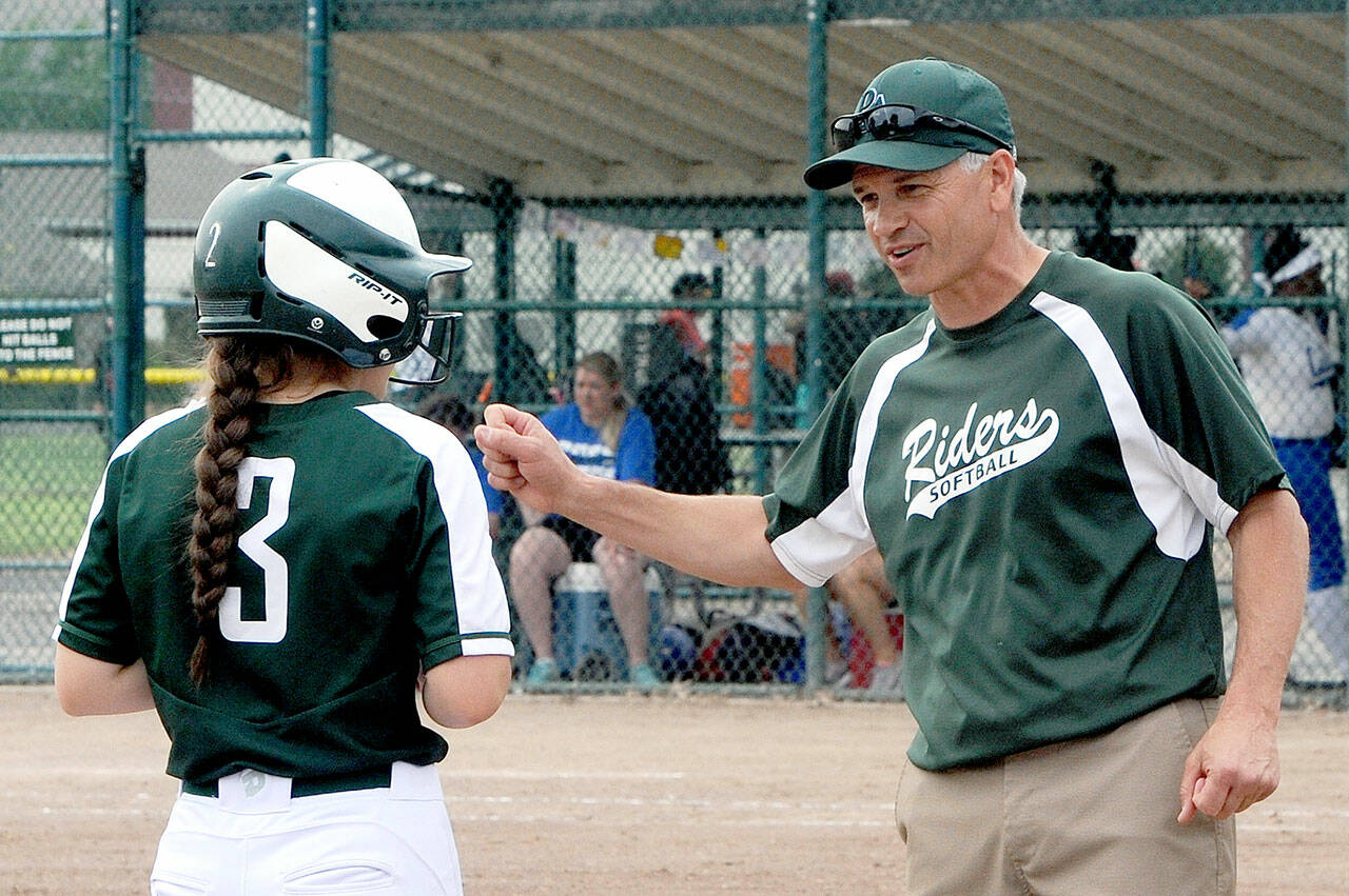 Port Angeles softball coach Randy Steinman offers advice to a base runner during the 2018 state tournament. Steinman has resigned as head coach after a decade leading the program. (Lonnie Archibald/for Peninsula Daily News)