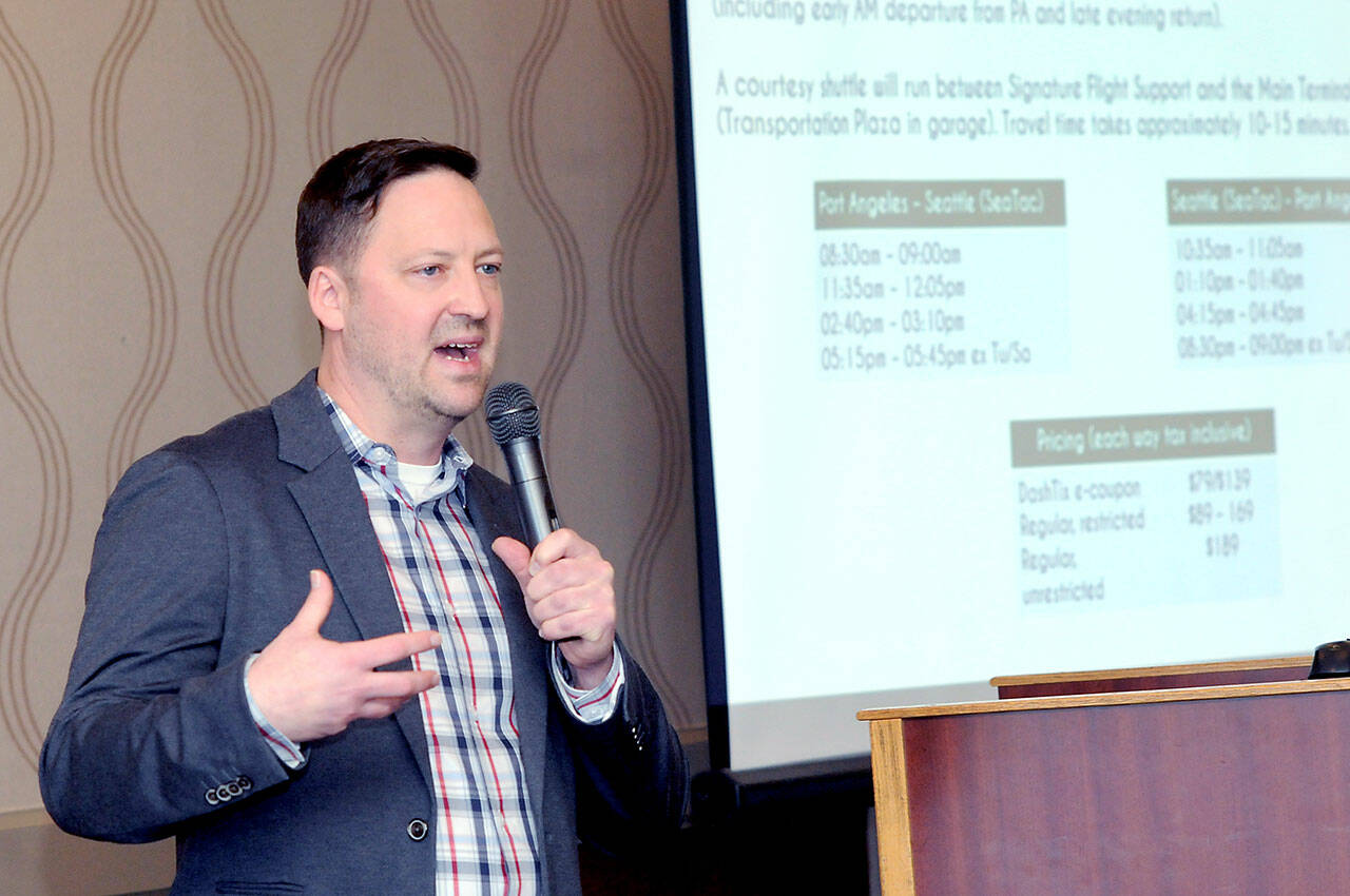 Clint Ostler, president of Dash Air Shuttle, provides an update on starting service during Wednesday’s Port Angeles Chamber of Commerce luncheon. (Keith Thorpe/Peninsula Daily News)