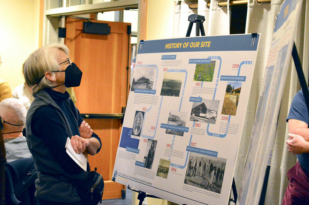 Margaret Groff of Port Townsend is among the scores of people perusing informational panels at Wednesday’s open house. (Diane Urbani de la Paz/For Peninsula Daily News)