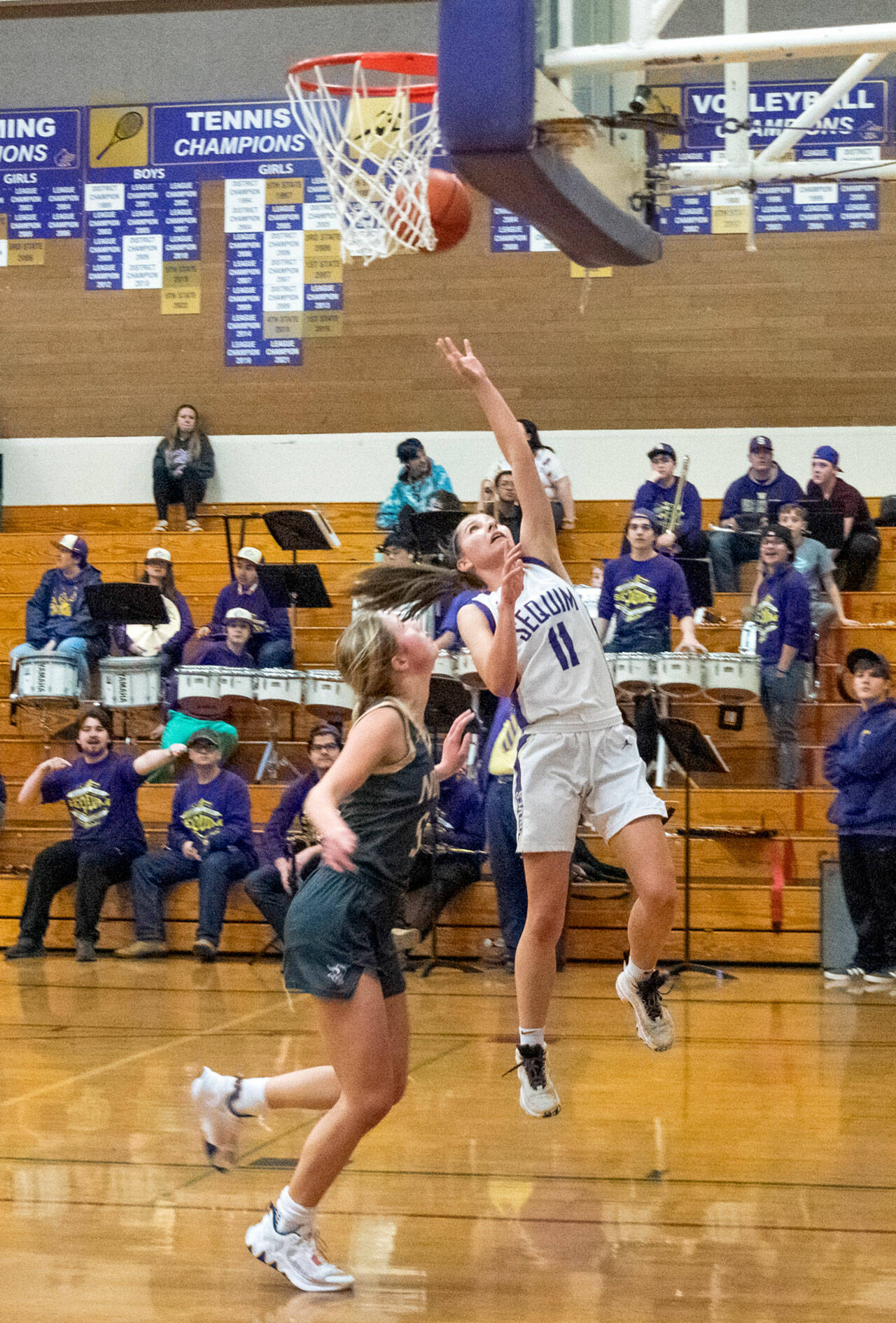 Emily Matthiessen /Olympic Peninsula News Group Sequim’s Taryn Johnson, right, looks to score in the Wolves’ 64-49 home win over North Kitsap on Thursday.