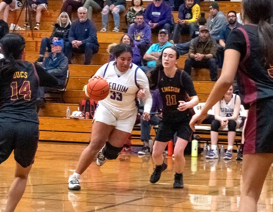 Sequim's Jelissa Julmist (33) drives the lane against Kingston on Friday night. Sequim won the game 72-28 to improve to 16-0 on the season. (Emily Matthiessen/Olympic Peninsula News Group)