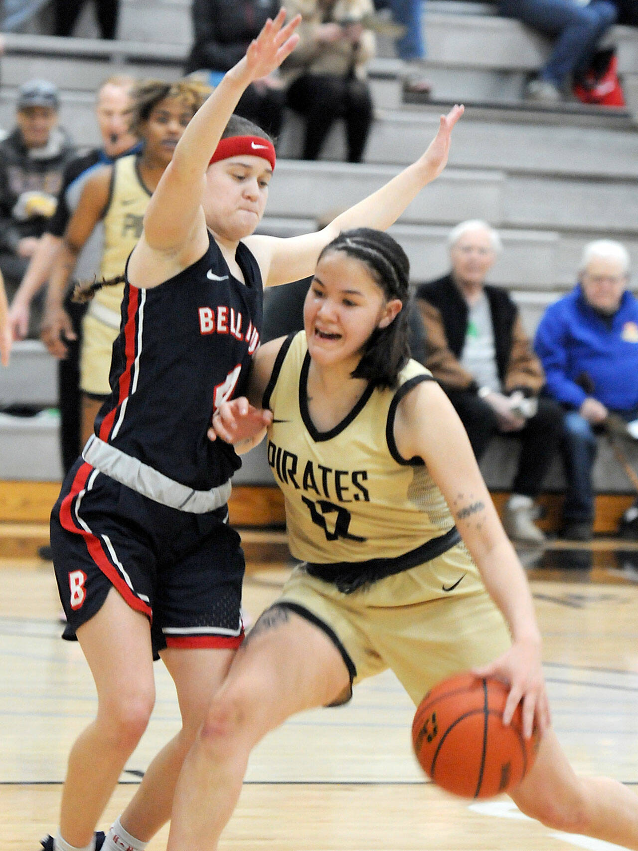 Peninsula’s Adam Kaganak, right, pushes into Bellevue’s Sav Huerta during Wednesday’s game in Port Angeles. (Keith Thorpe/Peninsula Daily News)