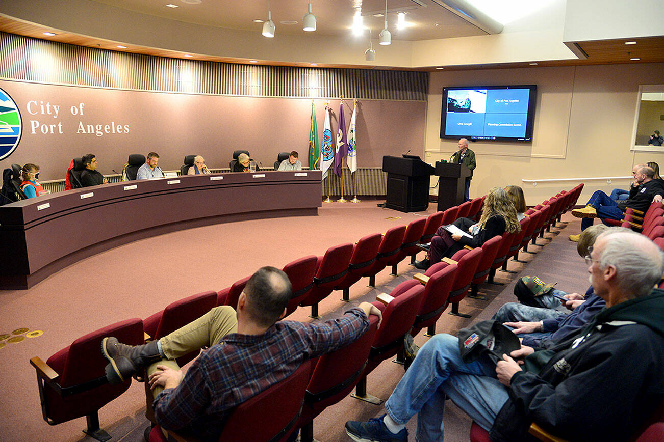 Former Port Angeles Mayor Frank McPhee gives testimony Wednesday evening at a Port Angeles Planning Commission meeting at City Hall. The city is weighing several changes to its zoning code in an attempt to increase the amount of local housing stock. (Peter Segall/Peninsula Daily News)