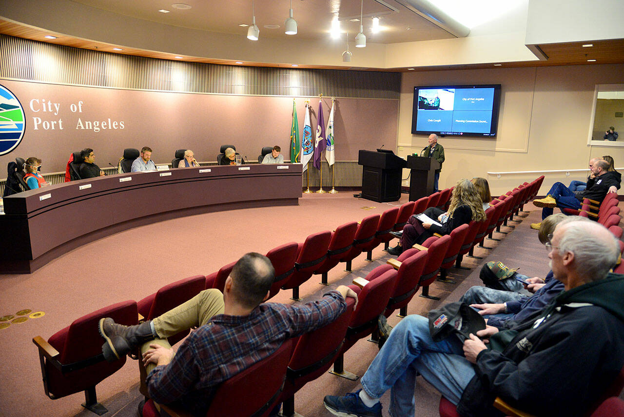 Former Port Angeles Mayor Frank McPhee gives testimony Wednesday evening at a Port Angeles Planning Commission meeting at City Hall. The city is weighing several changes to its zoning code in an attempt to increase the amount of local housing stock. (Peter Segall/Peninsula Daily News)