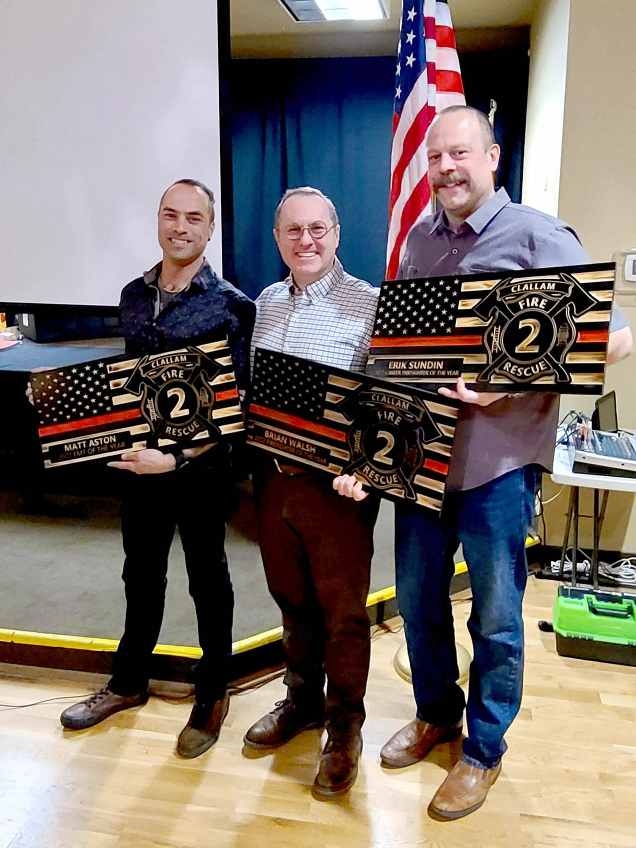 Clallam 2 Fire Rescue presented its annual awards for 2022 to, from left, Firefighter/EMT Matt Aston, Volunteer EMT of the Year; Firefighter/EMT Brian Walsh, Volunteer Firefighter of the Year; and Firefighter/paramedic Erik Sundin, Career Firefighter of the Year.