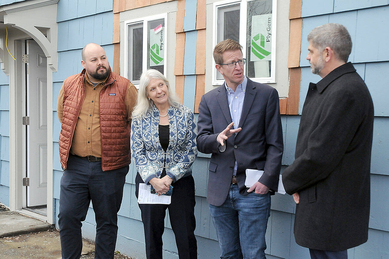 KEITH THORPE/PENINSULA DAILY NEWS
U.S. Rep, Derek Kilmer, second from right, talks with Clallam County Commissioner Mark Ozias, right, as Andrew Reiners, housing manager for Peninsula Behavaioral Health,  left, and Shanna Bloom, PBH finanace controller, listen in during a tour on Friday of the former All-View Motel in Port Angeles. Kilmer said that unallocated American Rescue Plan Act funds are in danger of hving to be returned to the federal government.  For story, see Page A??