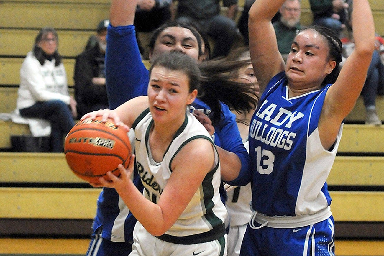 Keith Thorpe/Peninsula Daily News
Port Angeles' Lexie Smith, front,  looks for her teammates as North Mason's Tanza Tupolo, left, and Adrianna Tupolo, right, defend the lane during Thursday's district playoff at Port Angeles High School.