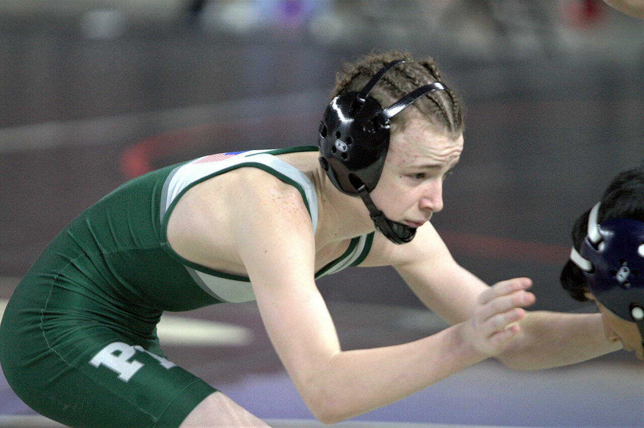 Steve Powell/North Kitsap Herald Port Angeles freshman Alex Burrow grapples with his opponent during a match Friday at Mat Classic XXXIV, the state wrestling championships, at the Tacoma Dome.