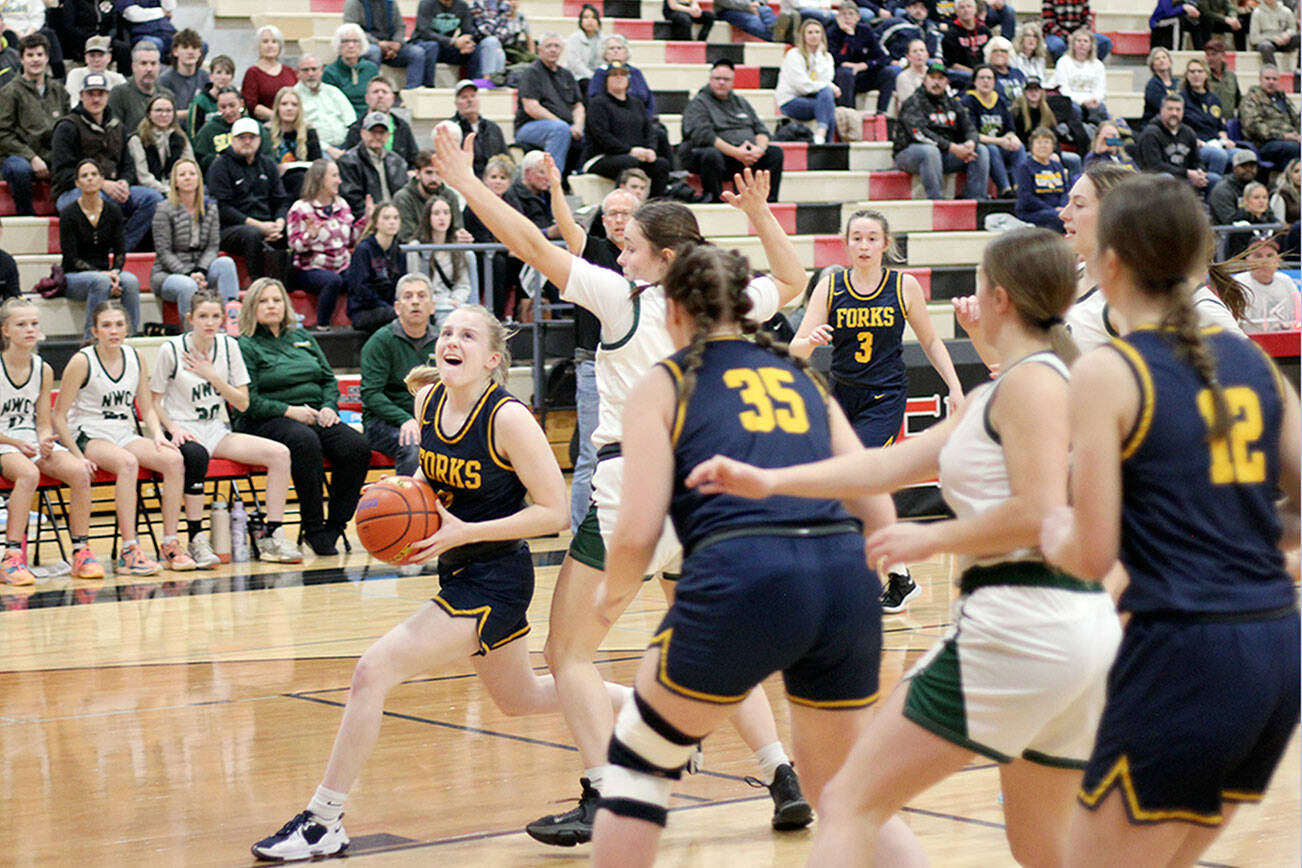 Drew Lawson/The Lincoln County Record-Times
Forks' Kadie Wood drives the lane during the Spartans' Class 2B state regional round contest against Northwest Christian (Colbert) at Cheney High School on Friday.