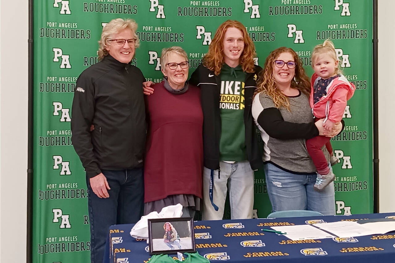 Jack Gladfelter celebrates his signing to run track and cross-country at Corban College in Salem, Ore., with his, from left, father Joe Gladfelter, mother Becky Gladfelter, sister Jamie Pond and niece Wren Pond. (Pierre LaBossiere/Peninsula Daily News)