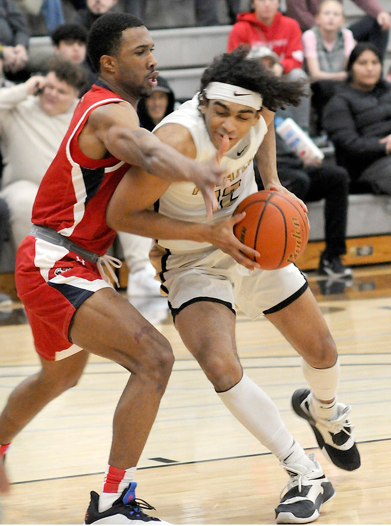 Peninsula’s Roosevelt Williams Jr., right, shoulders his way past Skagit Valley’s Omari Maulana earlier this season in a North Division game at Peninsula College. (Keith Thorpe/Peninsula Daily News)