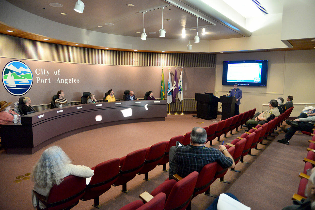 Housing Coordinator Holden Fleming speaks to the Port Angeles City Council at their regular meeting on Tuesday, when new zoning codes were adopted in an effort to bring additional housing to the city. (Peter Segall/Peninsula Daily News)