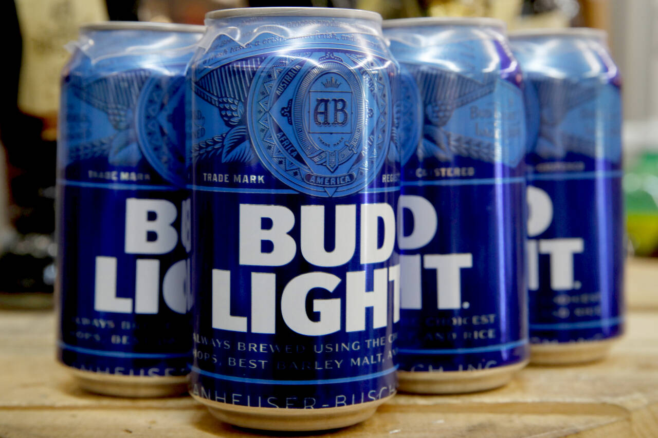 Cans of Bud Light beer are seen, Jan. 10, 2019, in Washington. On Friday, The Associated Press reported on stories circulating online incorrectly claiming Anheuser-Busch fired its entire marketing department in response to its partnership with a transgender influencer and the rollout of LGBTQ Pride-themed Bud Light cans that feature various pronouns. (Jacquelyn Martin/The Associated Press)