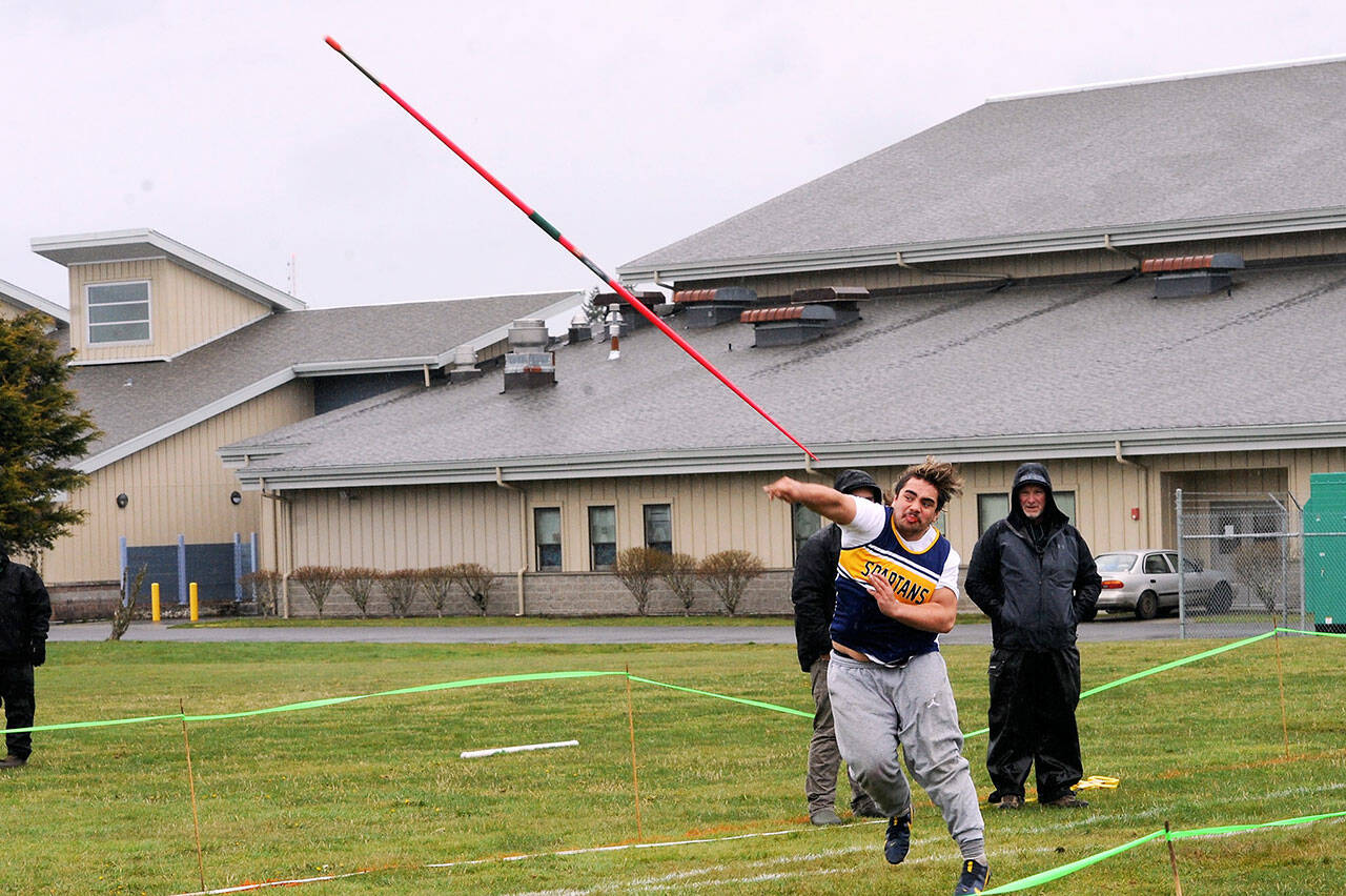 Forks’ Sloan Tumaua competes in the javelin throw Saturday at Spartan Stadium in the Forks Lions Club Invite. Tumaua came in seventh in the javelin but ended up winning the discus. (Lonnie Archibald/For Peninsula Daily News)