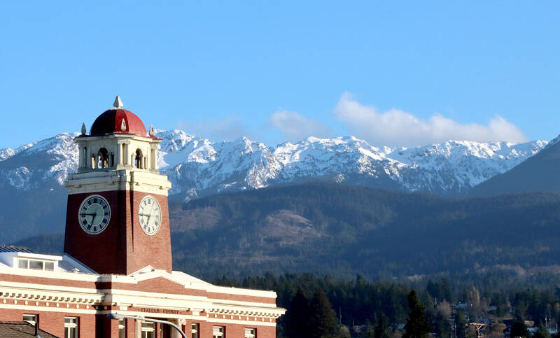 The Clallam County Courthouse is in the foreground while the Klahhane Ridge in the Olympic National Park is covered with fresh snow. High temperatures are expected to be in the the upper 40s to mid-50s this week with some rain showers in the forecast. (Dave Logan/Peninsula Daily News)