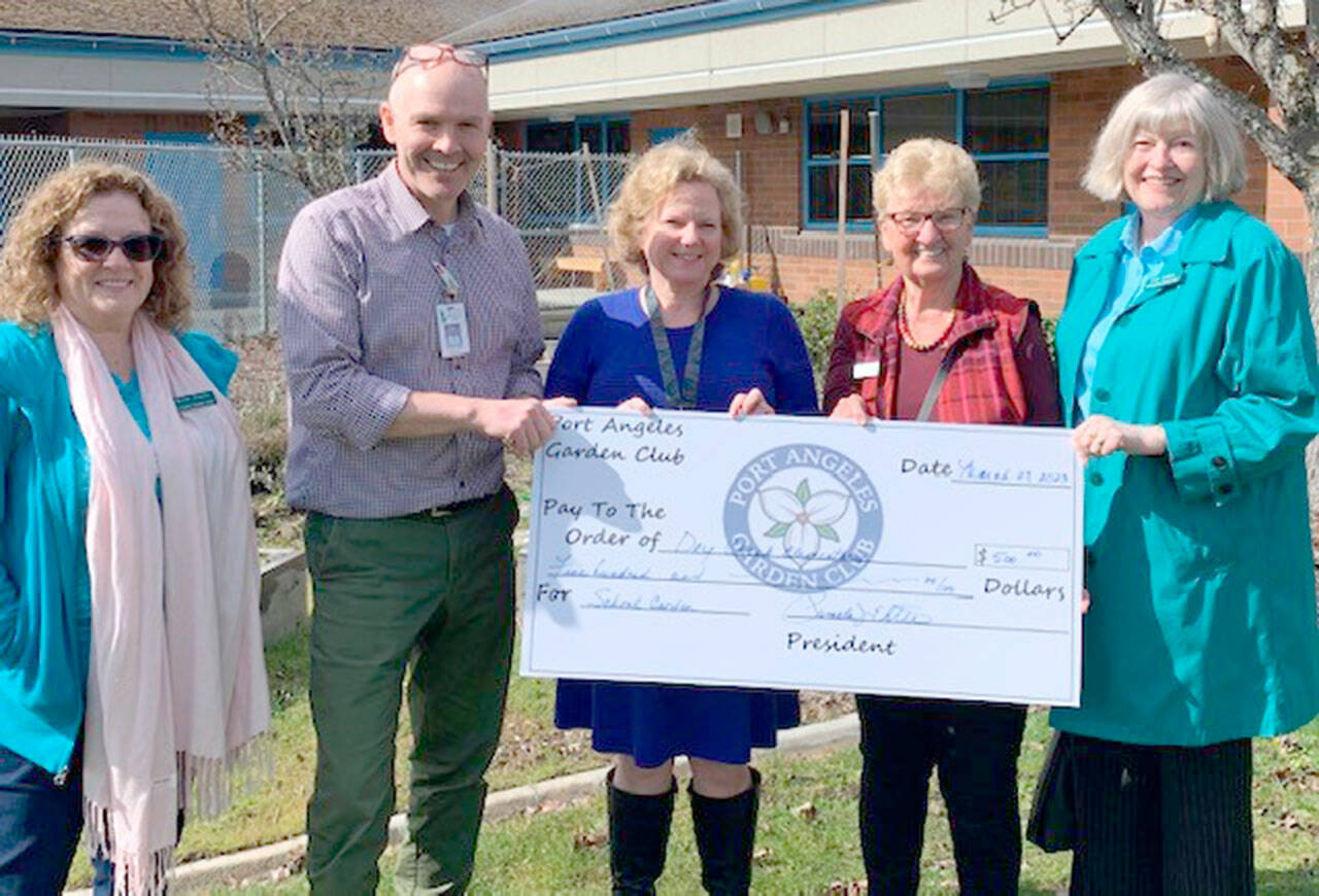 The Port Angeles Garden Club recently donated $500 to Amy Bryant, the principal at Dry Creek Elementary School, and sixth-grade teacher Anthony Seidl for a garden at the school. Pictured, from left to right, are Darlene Martin, Anthony Seidl, Amy Bryant, Linda Skolnik and Janet Russell.