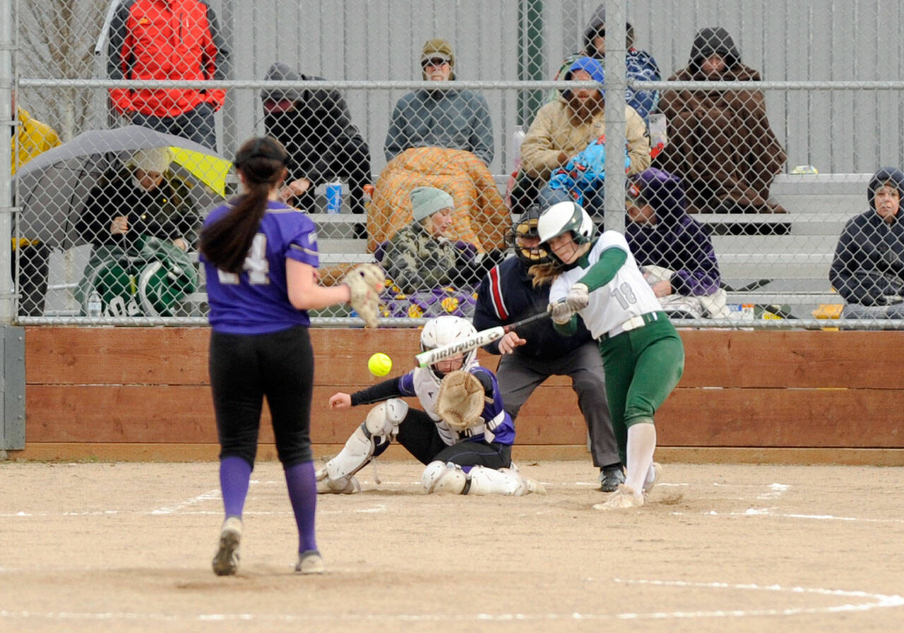 Port Angeles’ Lily Halberg swings at Sequim pitcher Lainey Vig’s offering during the Wolves’ 7-6 win over the Roughriders on Tuesday. (Michael Dashiell/Olympic Peninsula News Group)