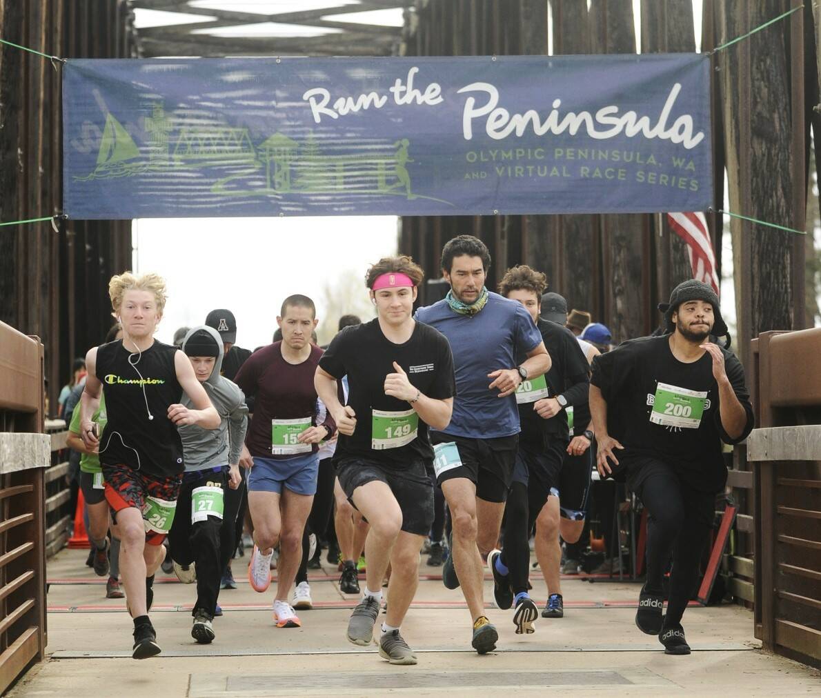 Nearly 300 runners take off in the Run the Peninsula’s Sequim Railroad Bridge run Saturday morning. (Michael Dashiell/Olympic Peninsula News Group)