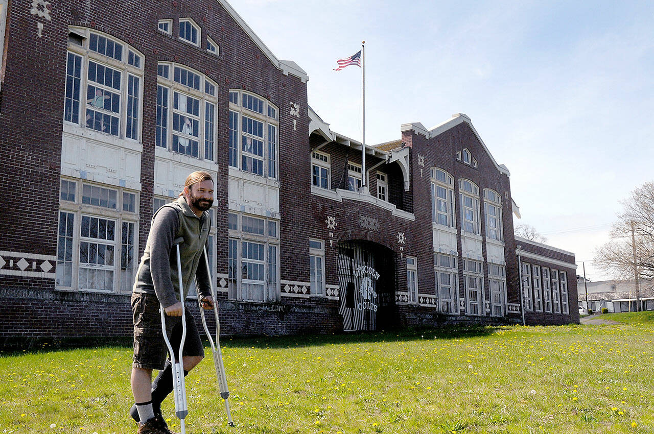 David Brownell, executive director of the North Olympic History Center, stands in front of the historic Lincoln School at Eighth and C streets in Port Angeles on Tuesday. The NOHC is hoping to divest itself of the school building and has issued a request for proposal on what to do with the structure. (Keith Thorpe/Peninsula Daily News)