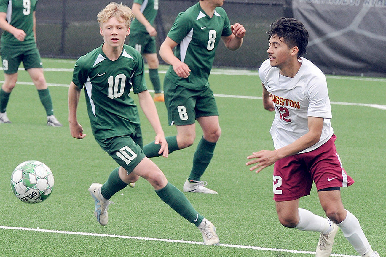 KEITH THORPE/PENINSULA DAILY NEWS
Port Angeles' Matthew Miller, left, chases a loose ball ahead of Kingston's Edwin Vallecillo, right, as Miller's teammates, from left, Hannes Spieker, Kaleb Gagnon and Jacob Miller watch from the backfield during Saturday's match in Port Angeles.