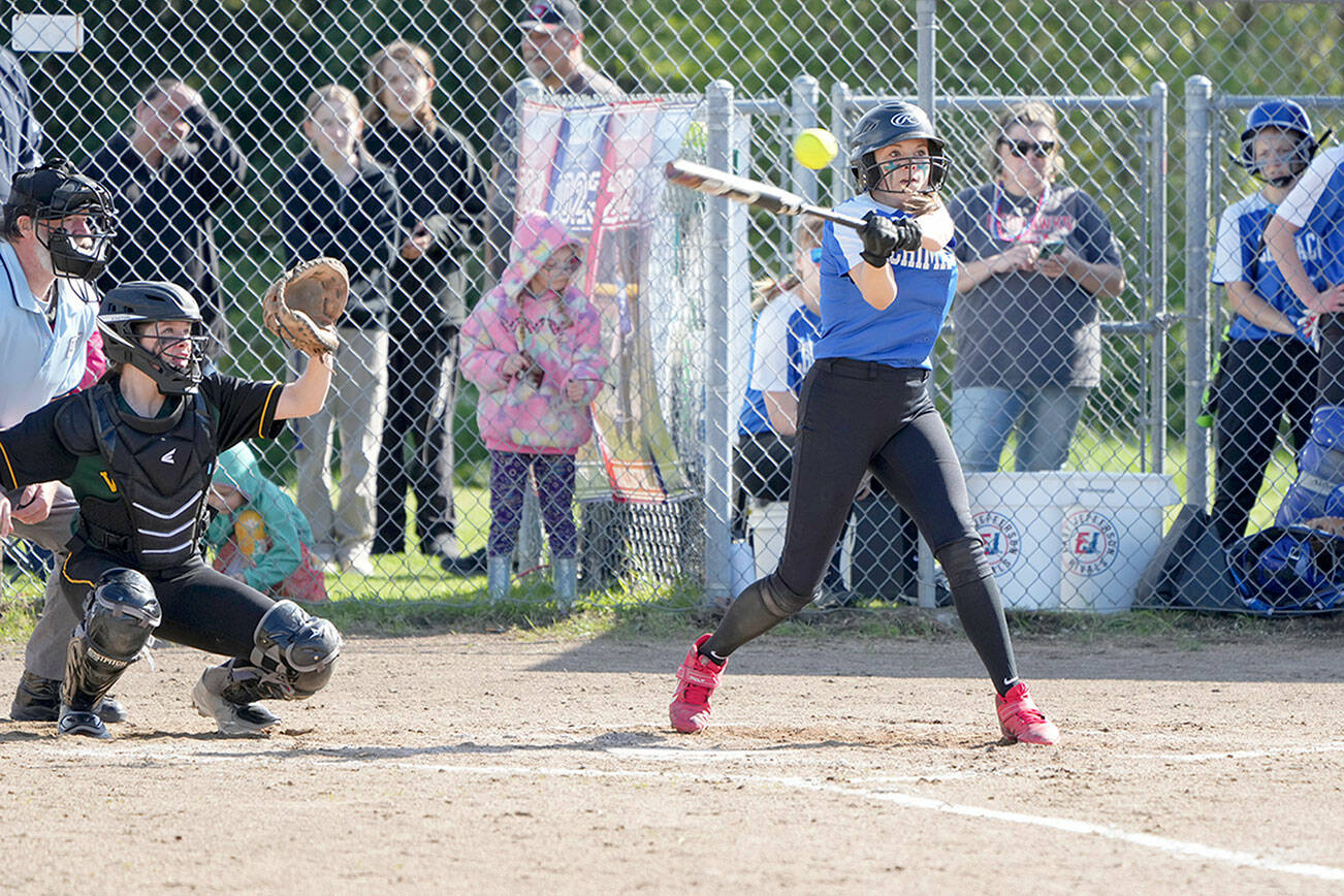 Rival’s Gracie Smith hits a stand-up triple during this at bat against the Vashon Pirates in a game on Monday played at Blue Heron Middle School. She later scored a run on a steal to home.