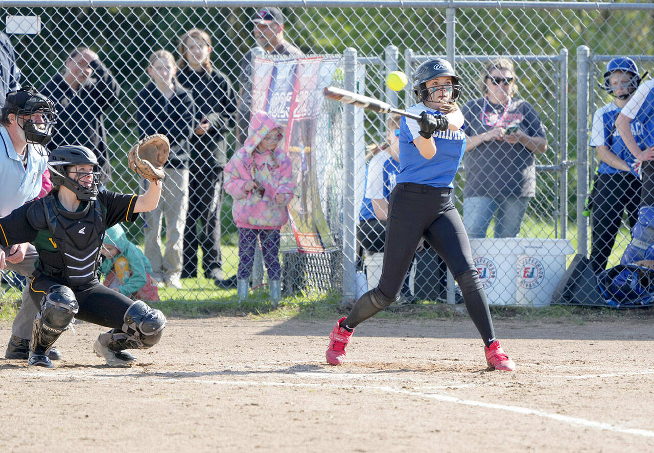 The Rivals’ Gracie Smith hits a stand-up triple during this at bat against the Vashon Pirates in a game on Monday played at Blue Heron Middle School. She later scored the first run on a steal to home. (Steve Mullensky/for Peninsula Daily News)